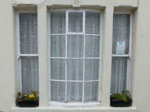 before the sash and casement window restoration started in worthing west sussex