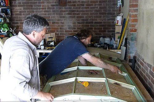 Installing the new glazing bars for the replacement window in the workshop in Hove East Sussex this is made for a project in worthing west worthing