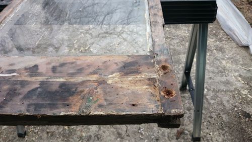 Door completely stripped with paint and some of the rot taken out before assessment on the Brunswick Square and Palmeira square Hove East Sussex restoration